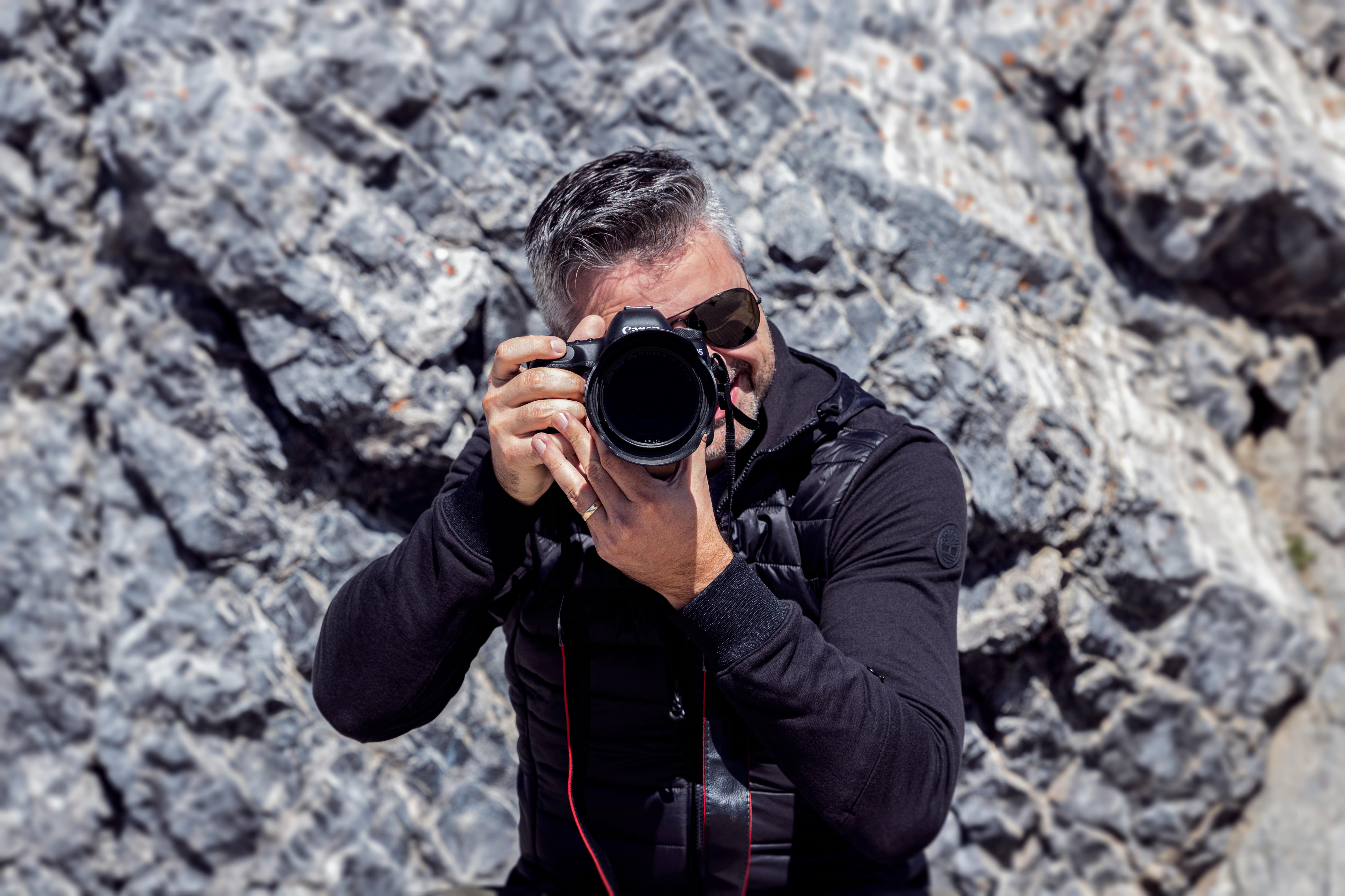 Independent photographer working with professional equipment